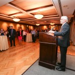 Dr. David HEath speaking to people at the Alumni Reunion party 2015