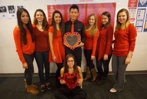 Students pose for a group show at at 13th Annual National Wear Red Day for Women