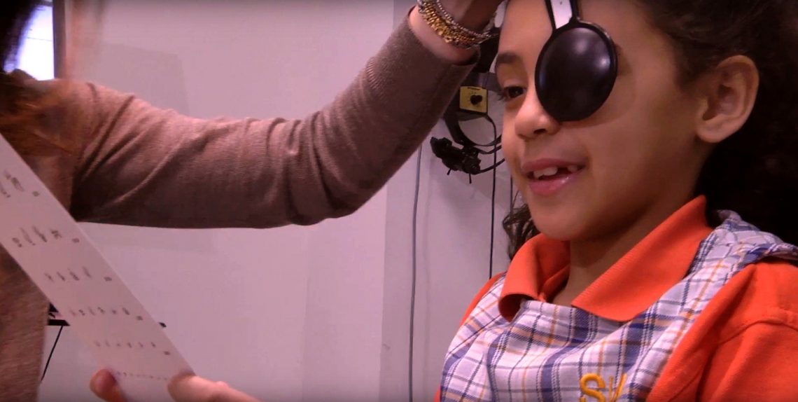 Child taking eye exam