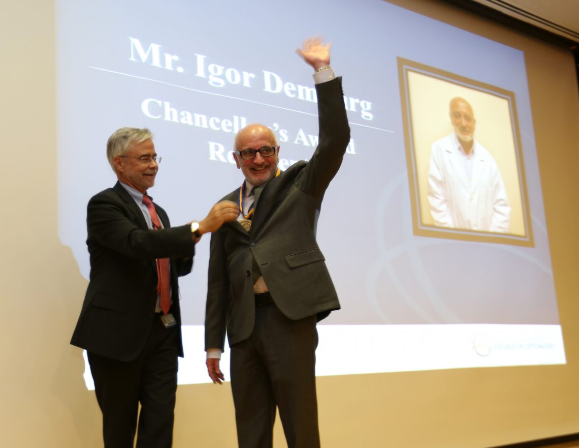 Dr. Heath gives award to Igor Demburg
