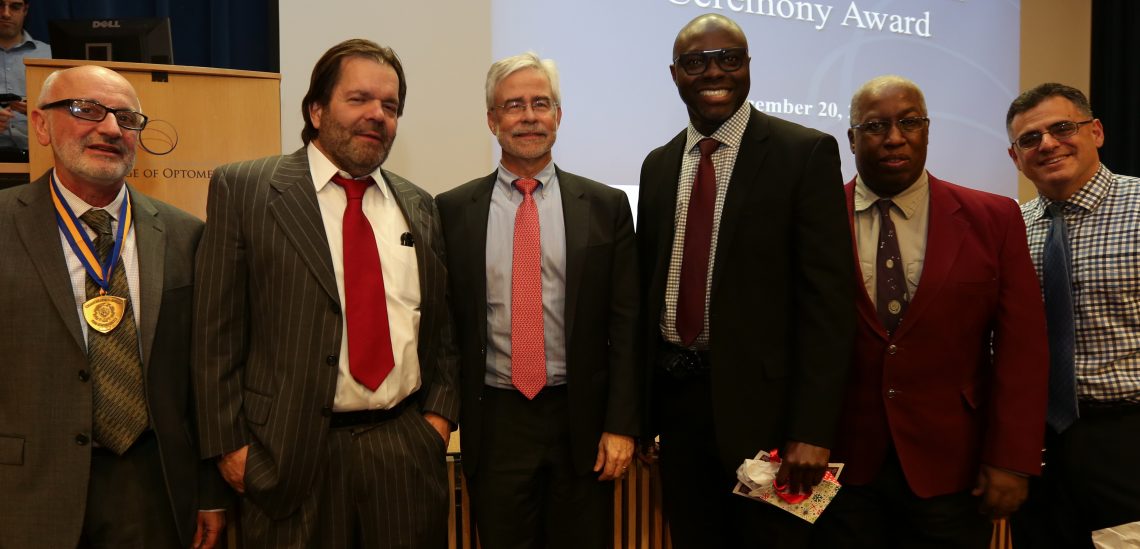 Faculty and staff pose at the Annual Ceremony