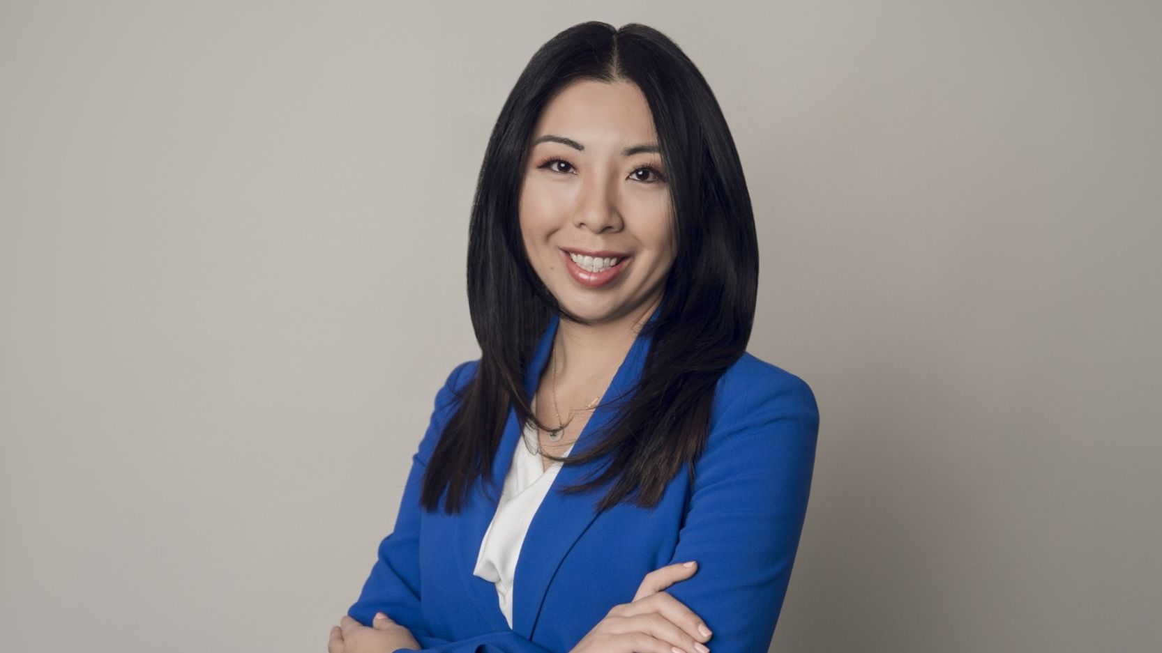 Photo of Marina Su, wearing a blue blazer, OD, FAAO, as Vice President for Clinical Affairs and Executive Director of the University Eye Center.