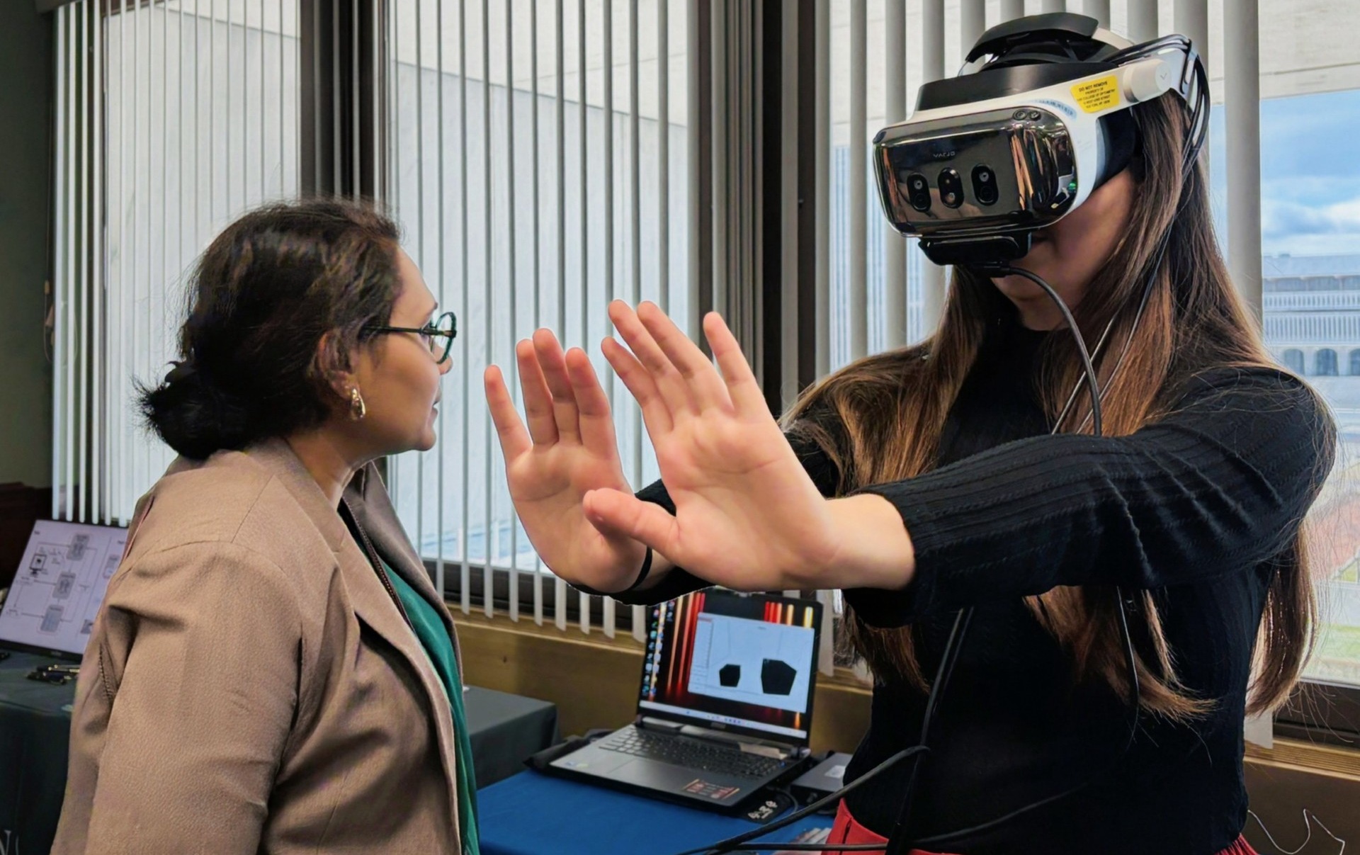 Dr Arathy Kartha demonstrating myopia‑control glasses.