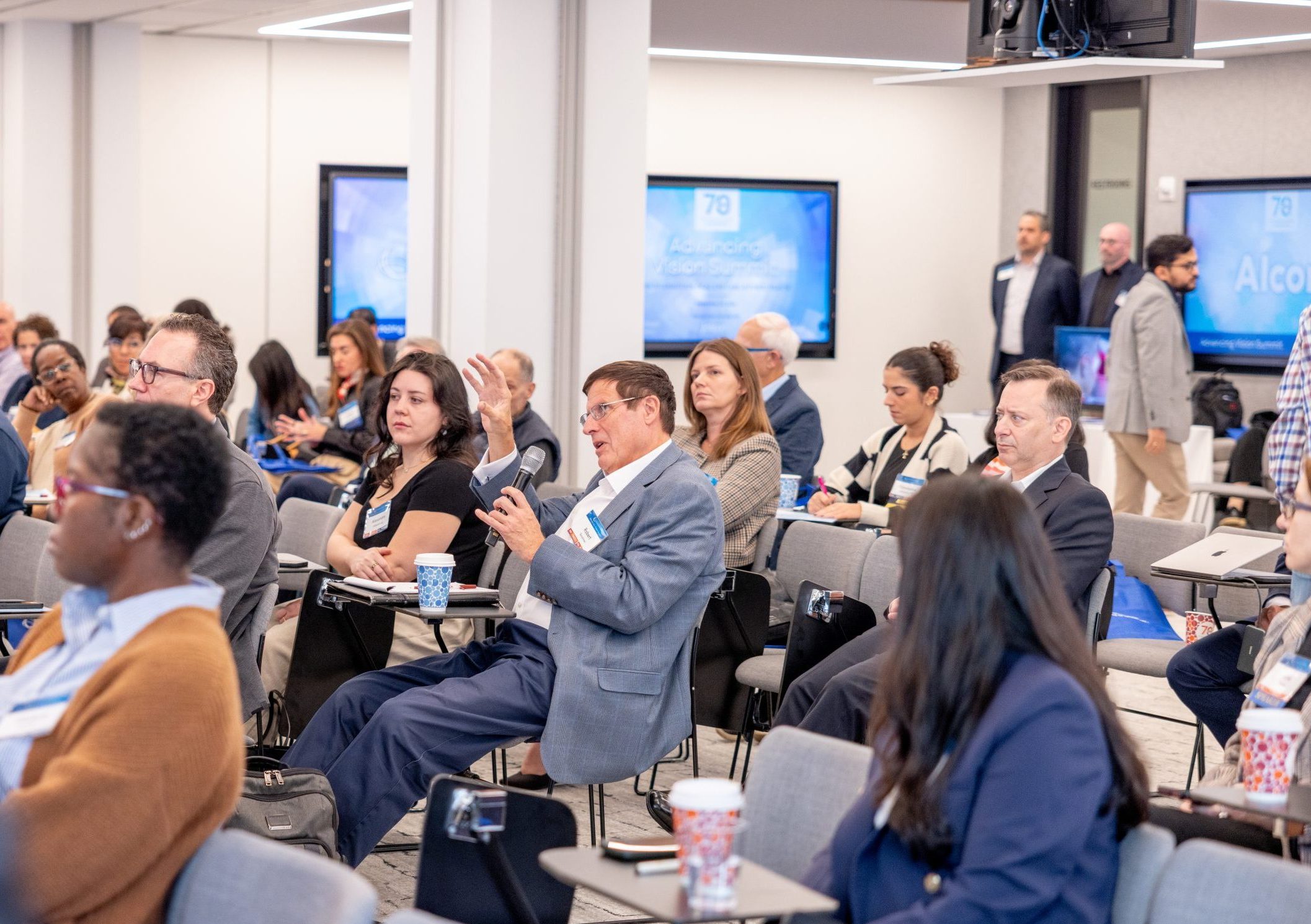 Group of audience members at Advancing Vision Summit SUNY Optometry