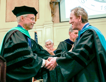 President Heath (left) congratulating Dr. Scott Richter after the presentation of the Presidential Medallion