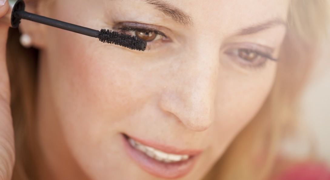 Woman applying eye makeup